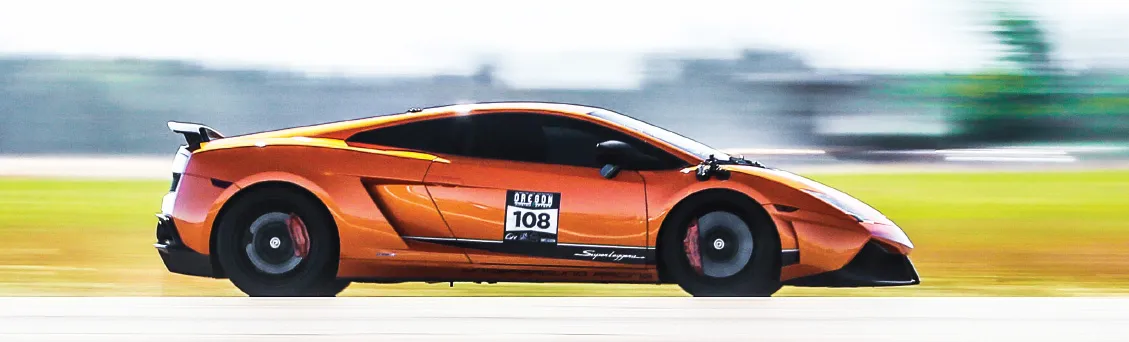 Red sports car with 333 racing number