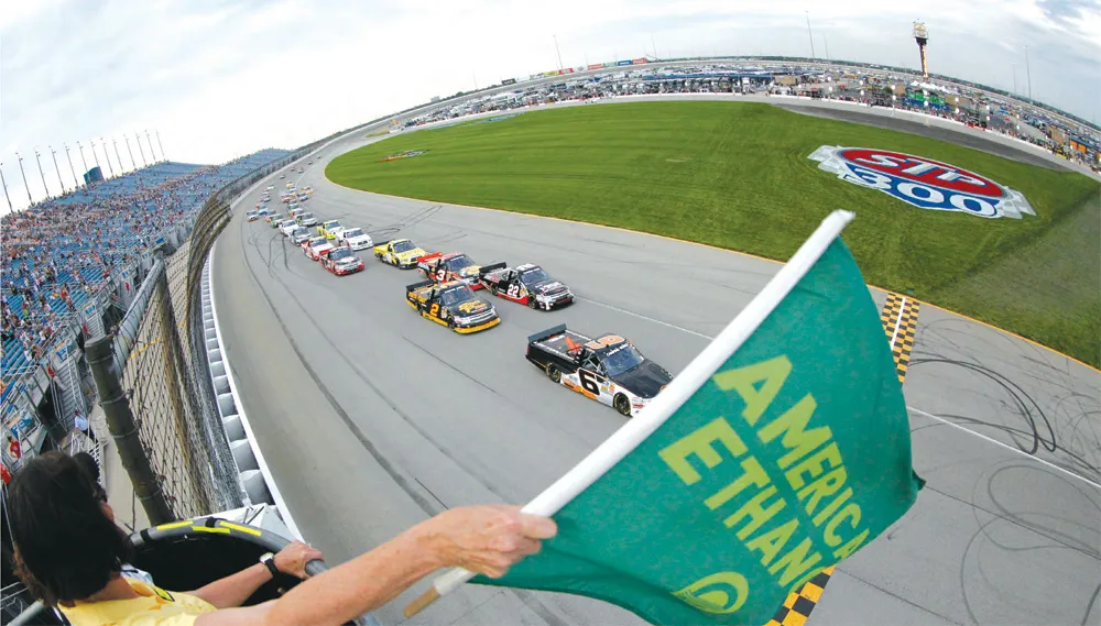 NASCAR stock cars race on an oval track