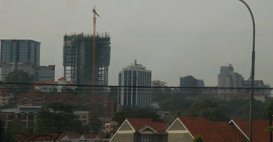 Crane atop a partially built high-rise