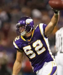 Vikings linebacker number 52 reaching with ball