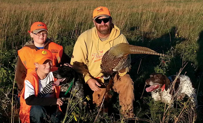 2013 pheasant opener on Ristau Farm - Gunner and Garret (11 year-old twins) with their father, Jim Ristau