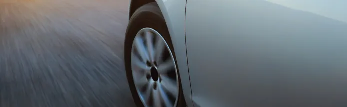 Close-up of car wheel on road