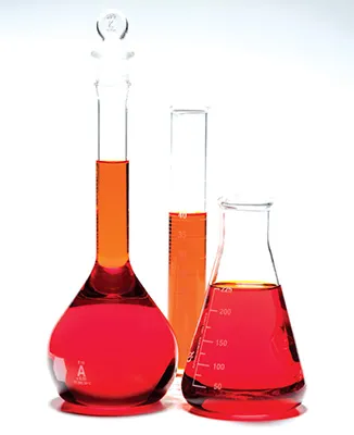 Three glass labware with red liquid