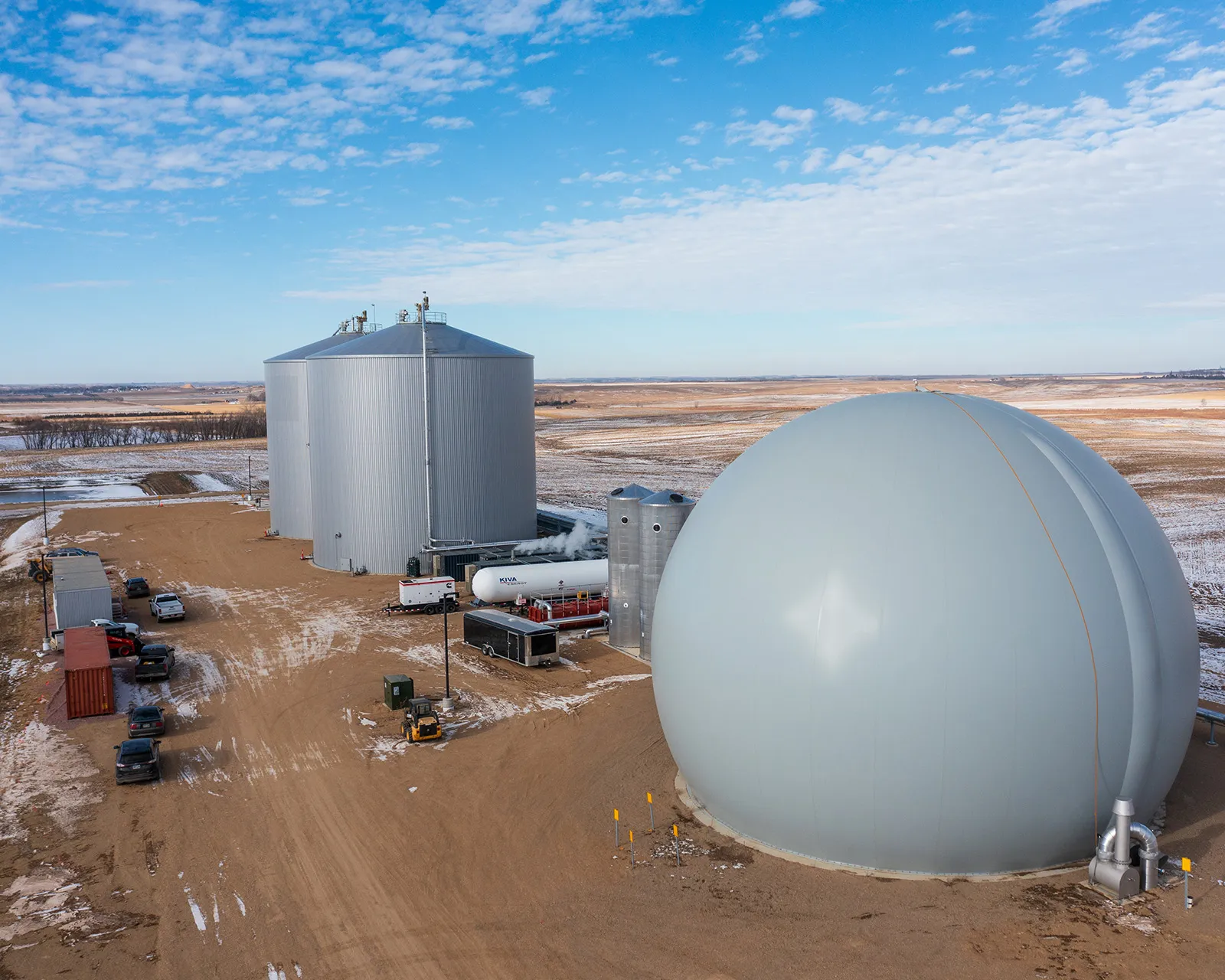 Large gray spherical storage tank at site