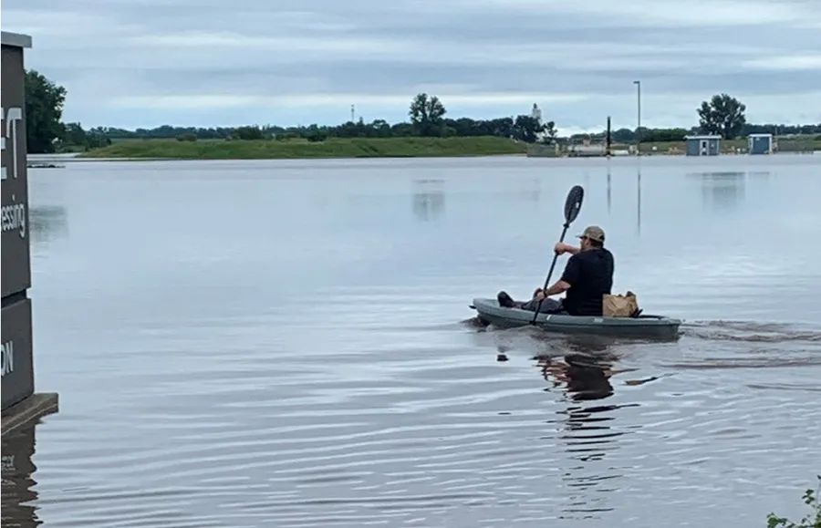  Kayaker paddling on calm water