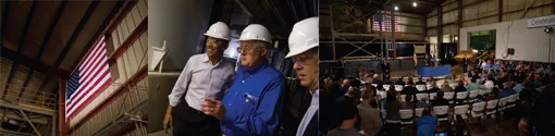 People in hard hats on a factory tour