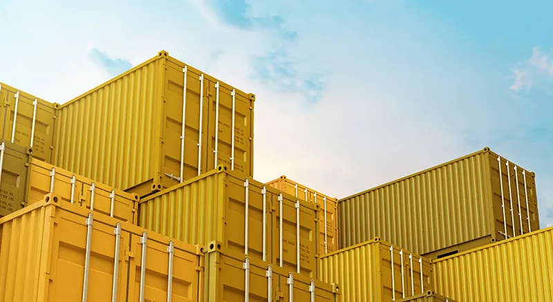 Yellow shipping containers stacked high