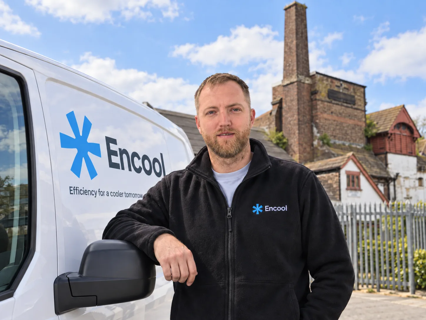 Encool engineer beside a branded Encool van outside the Old Brewery, Horley, Surrey
