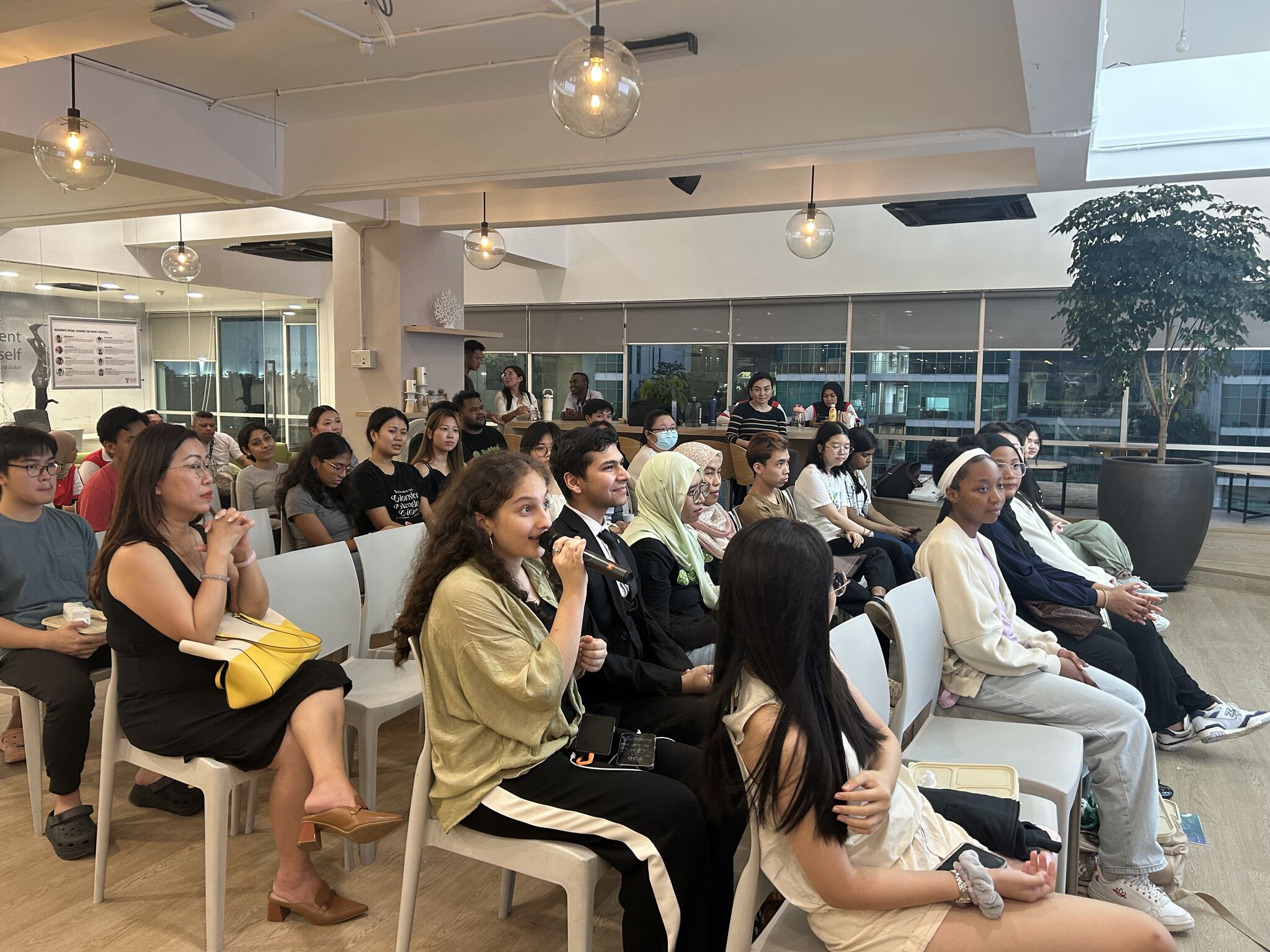 Earth Day event at Taylor's Residence - student asking questions