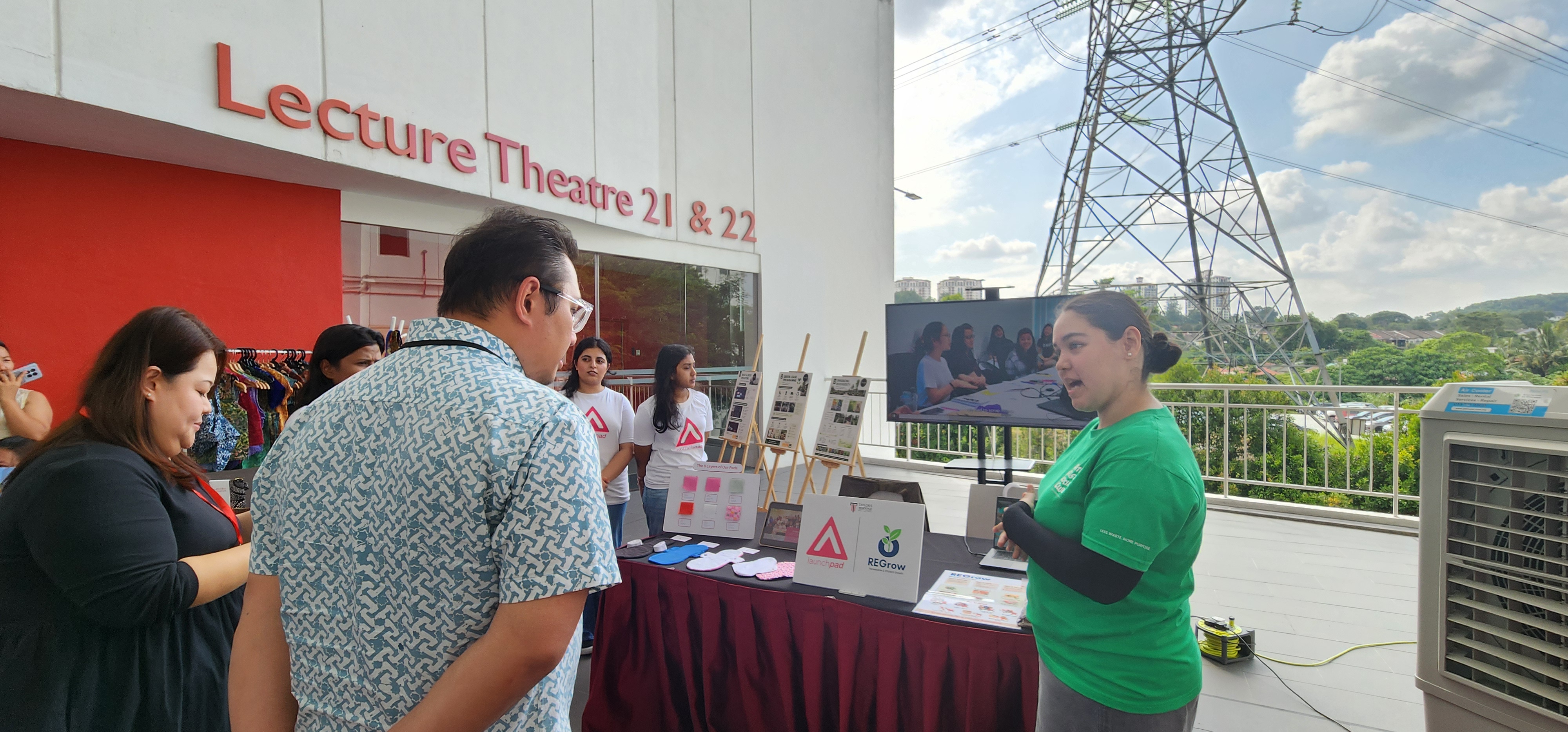 Student volunteer sharing the REGrow sustainability initiative with visitors at ESG Festival 6.0.