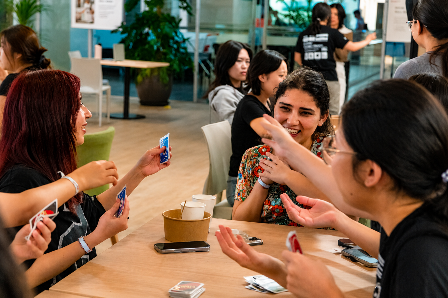 Residents connecting and enjoying friendly card games together during the SRC Social Board Game Night.