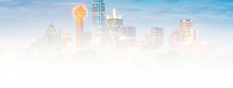 Faded skyline of Dallas, Texas with recognizable buildings and the illuminated Reunion Tower.