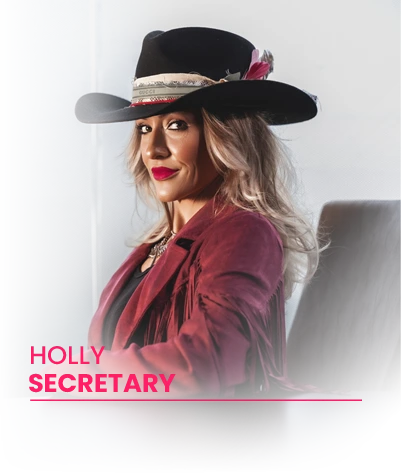 Woman wearing a black wide-brimmed hat with feathers and a maroon fringed jacket, sitting confidently and smiling slightly.