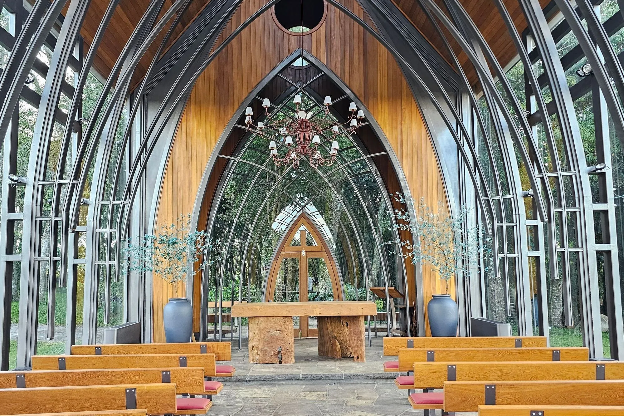 Light-filled chapel with wooden pews