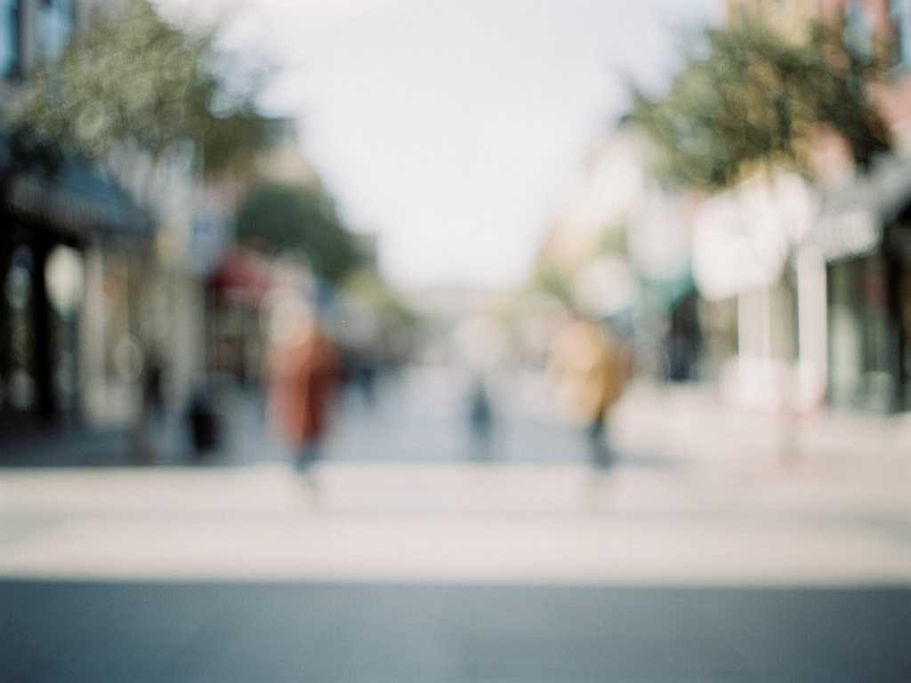 Blurry Image of street and people walking