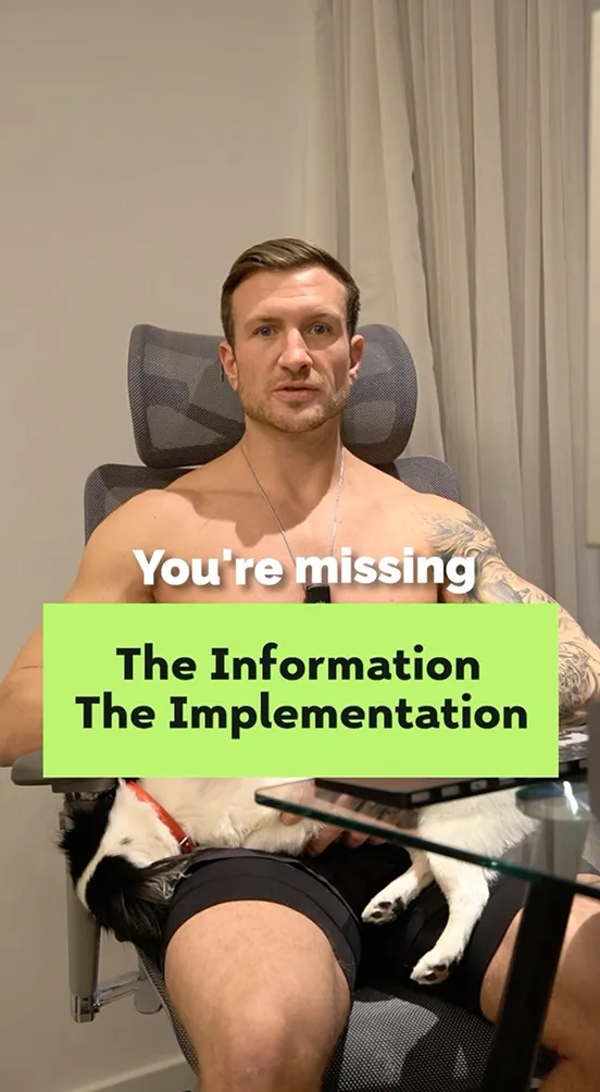 Shirtless man sitting at desk with text overlay about missing information.