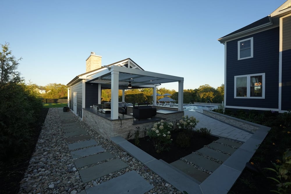 Gravel around patio and pool house by Deckscapes of Virginia