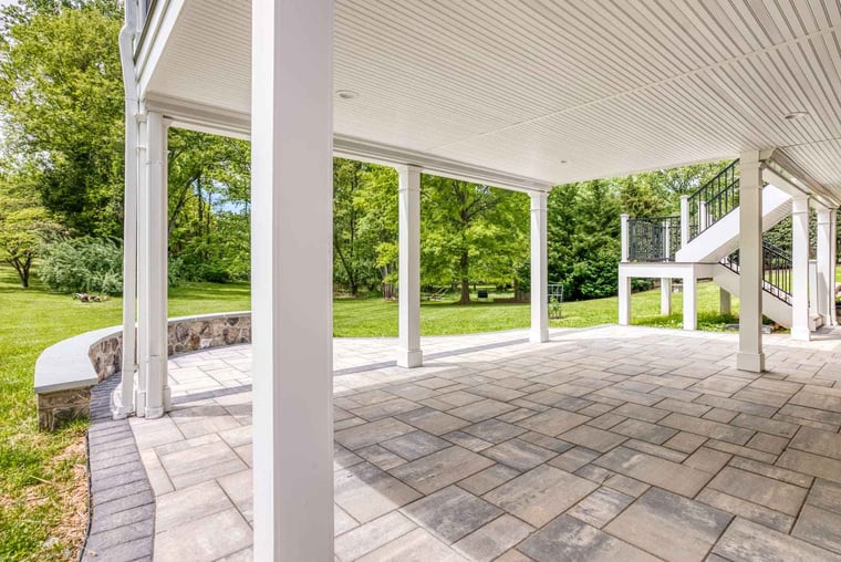 Under deck drainage system with patio