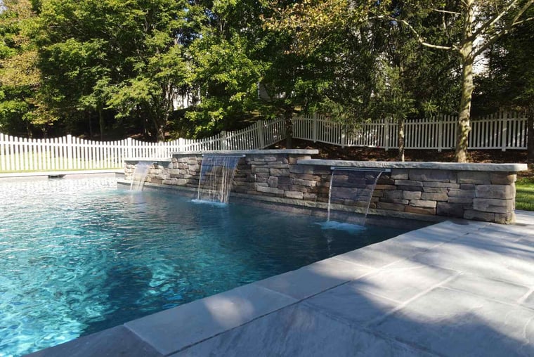 Staggered waterfall feature with stacked stone detailing