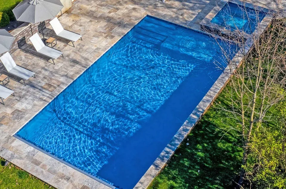 Drone view of gunite pool and raised deck by Deckscapes of Virginia