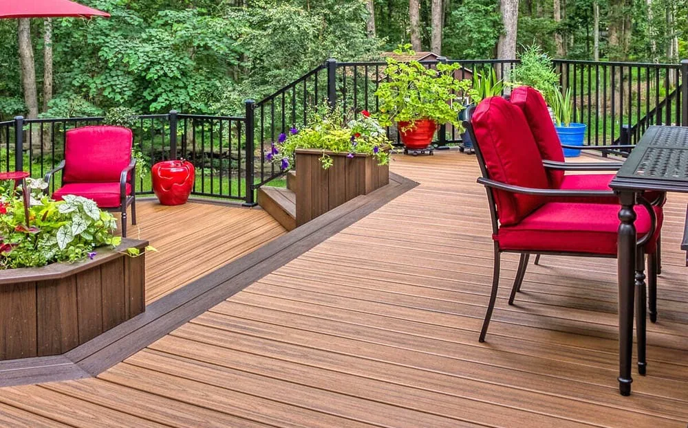Potted plants and furniture on multi-level deck design by Deckscapes of Virginia