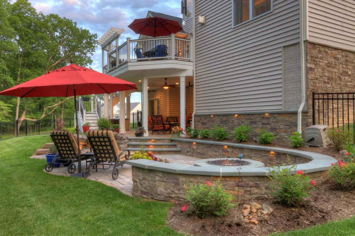 Luxury patio area with curved retaining wall and built-in lighting