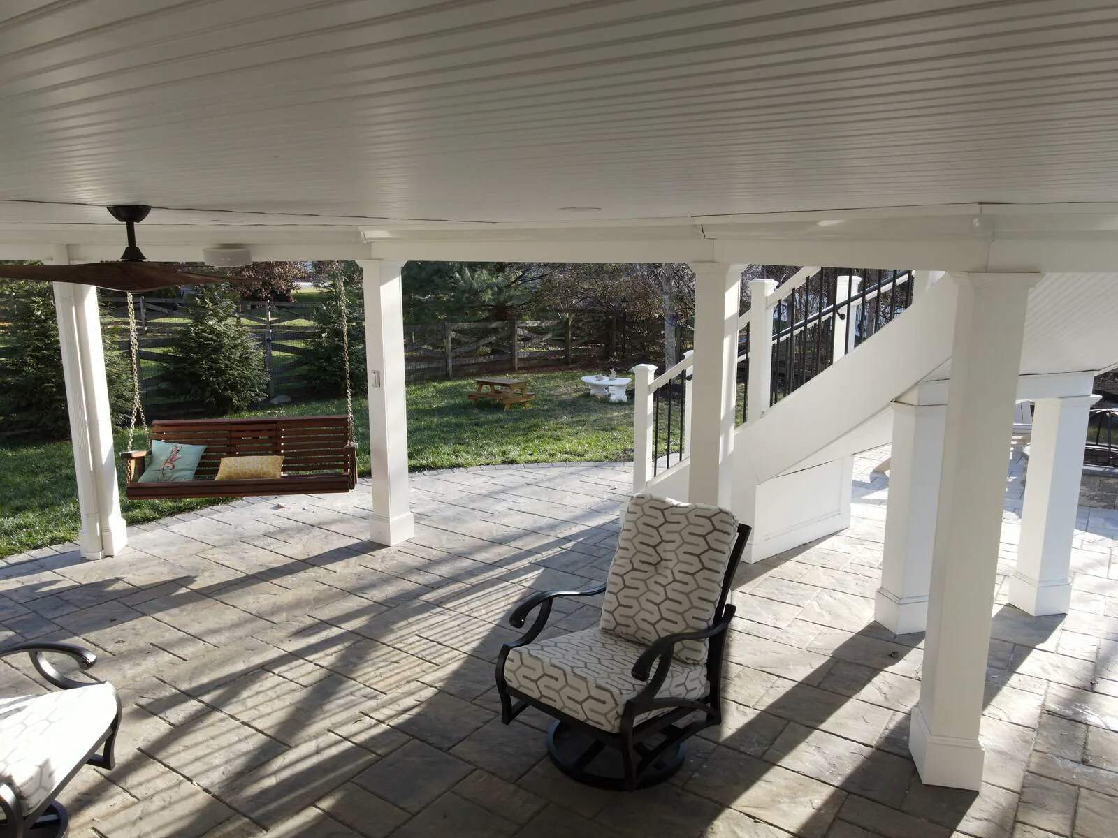 White under-deck system with fan and hanging swing