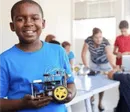 Boy showing motor project