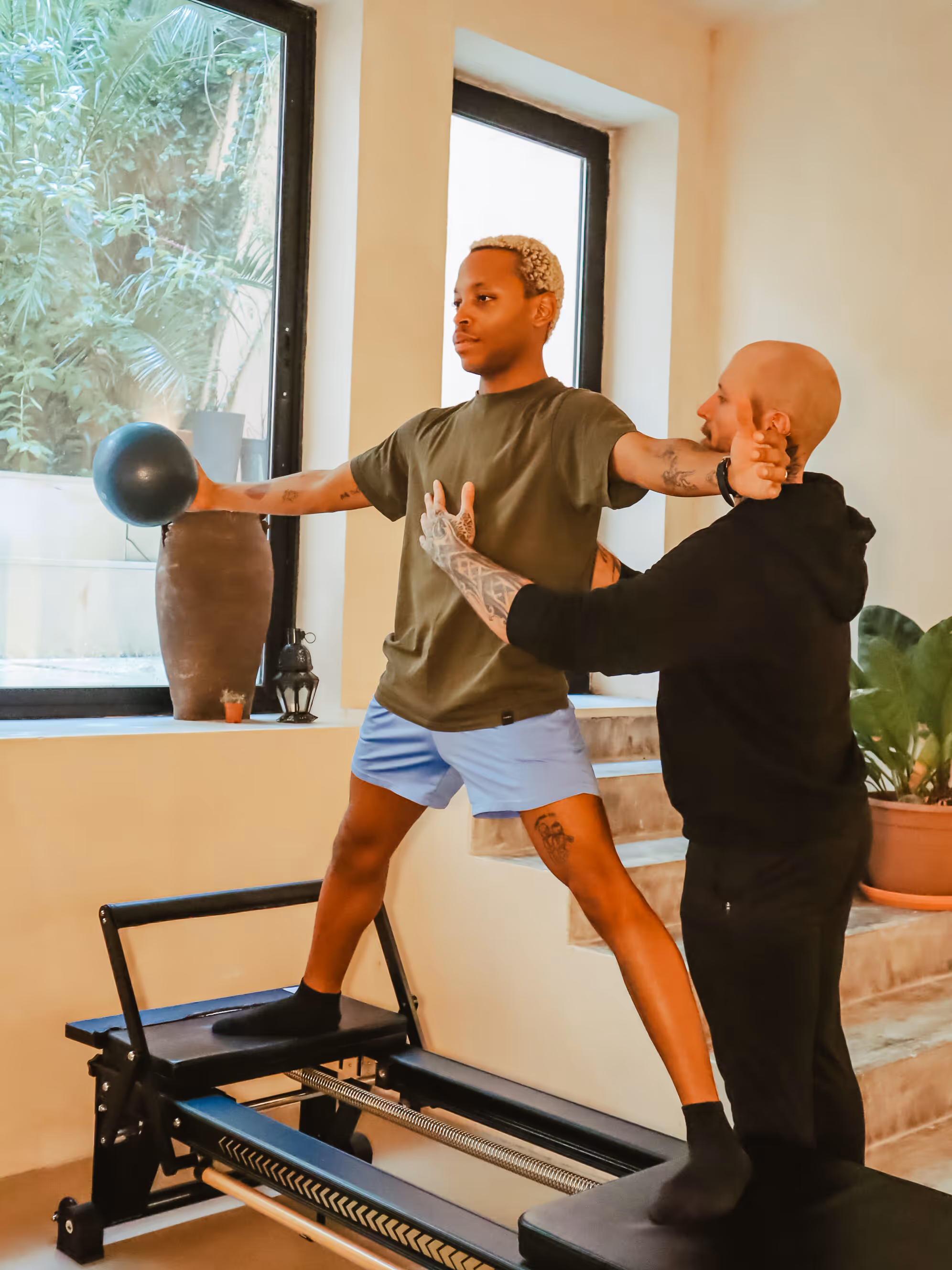 A man giving pilates instructions