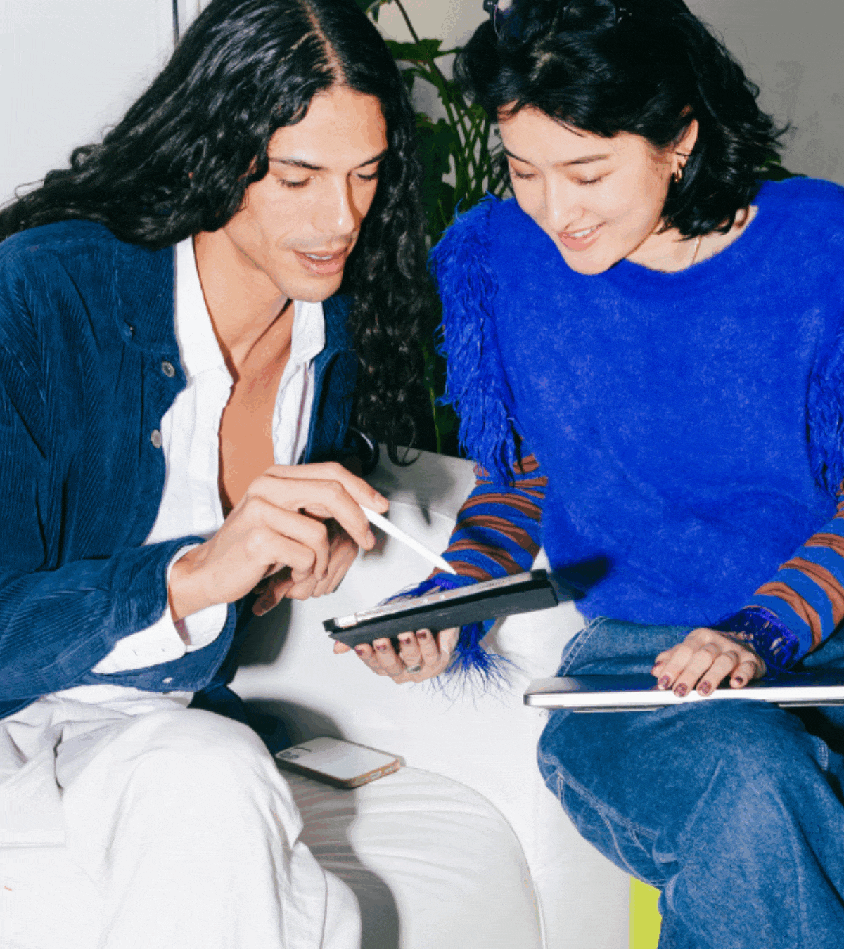 Two people working in office.