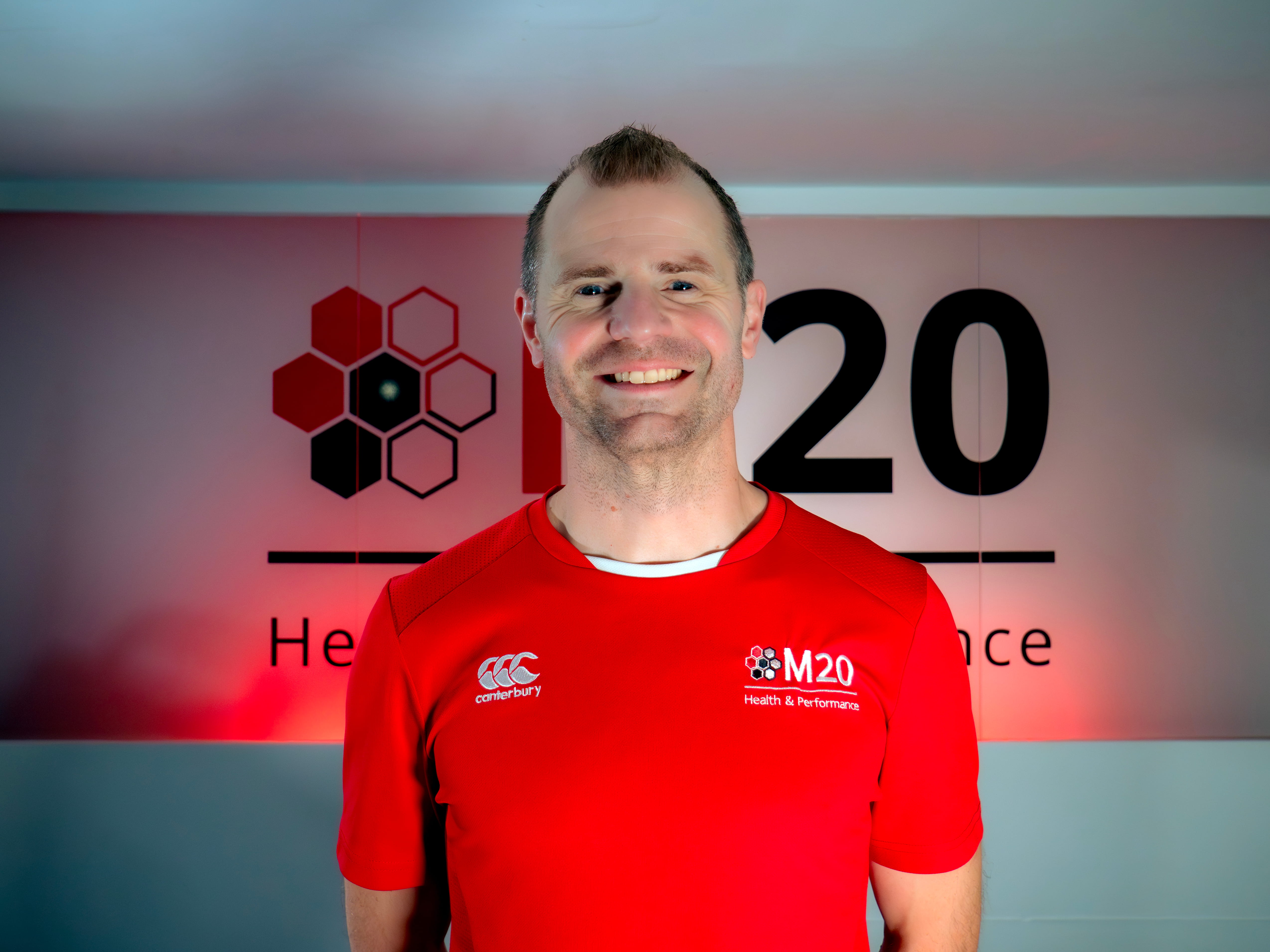 Portrait photo of Adam Naylor, the clinic director, sports science and performance lead for M20 Health & Performance