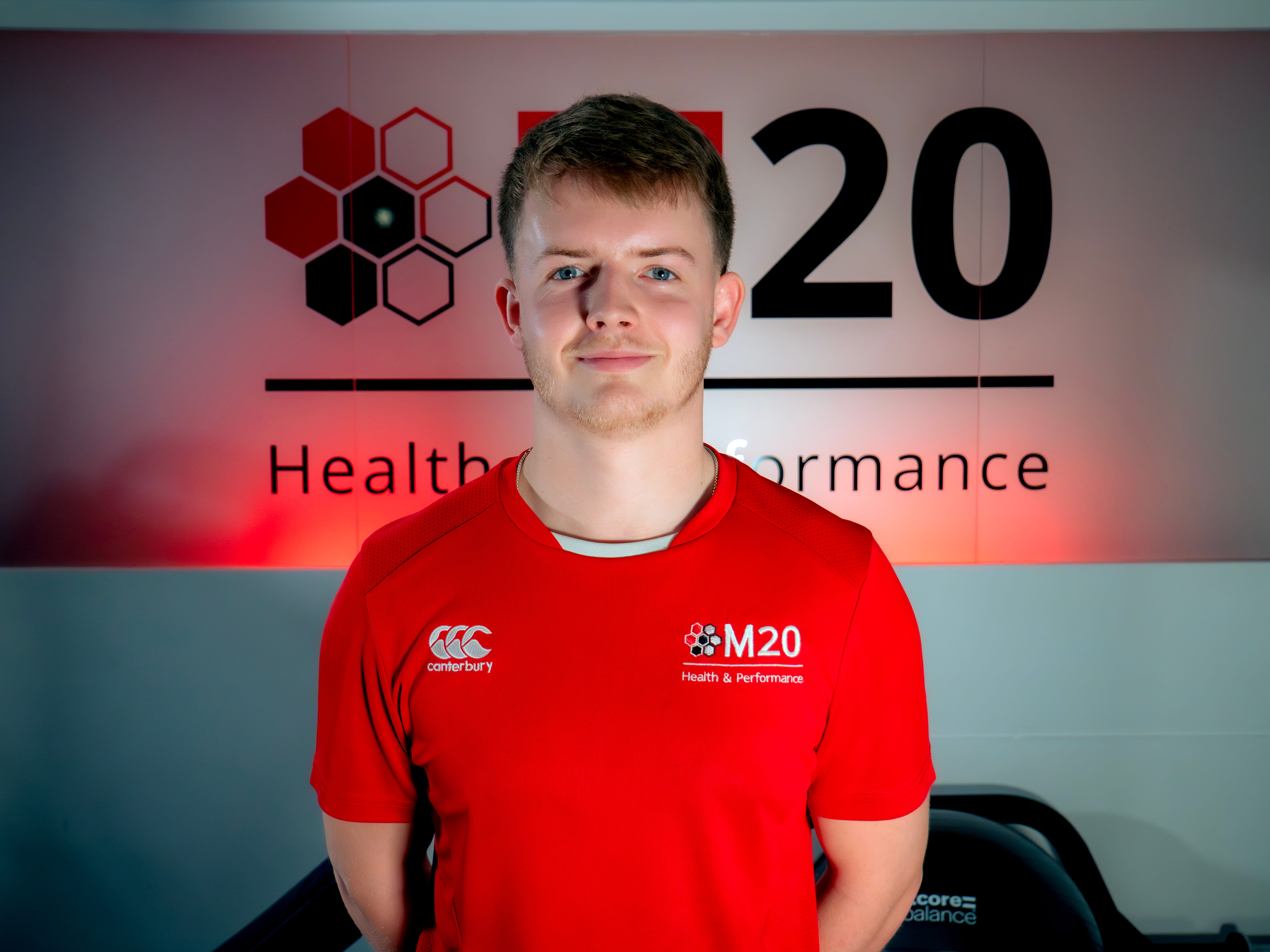 A portrait image of Ryan Parker, sports rehabilitator and swimming teacher level 2 for M20 Health & Performance
