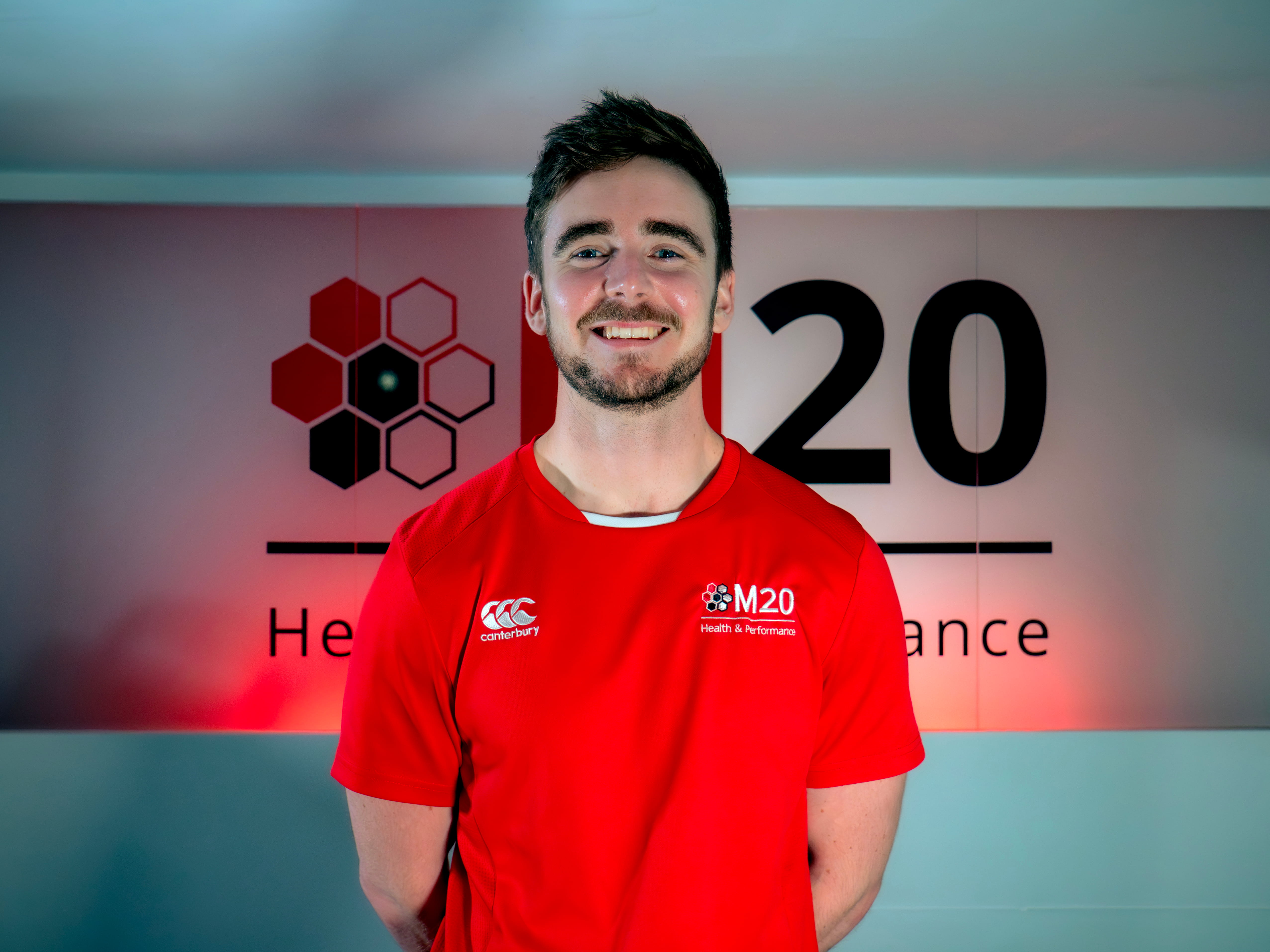A portrait image of Ethan Stamp, clinic director, sport science and performance lead for M20 Health & Performance