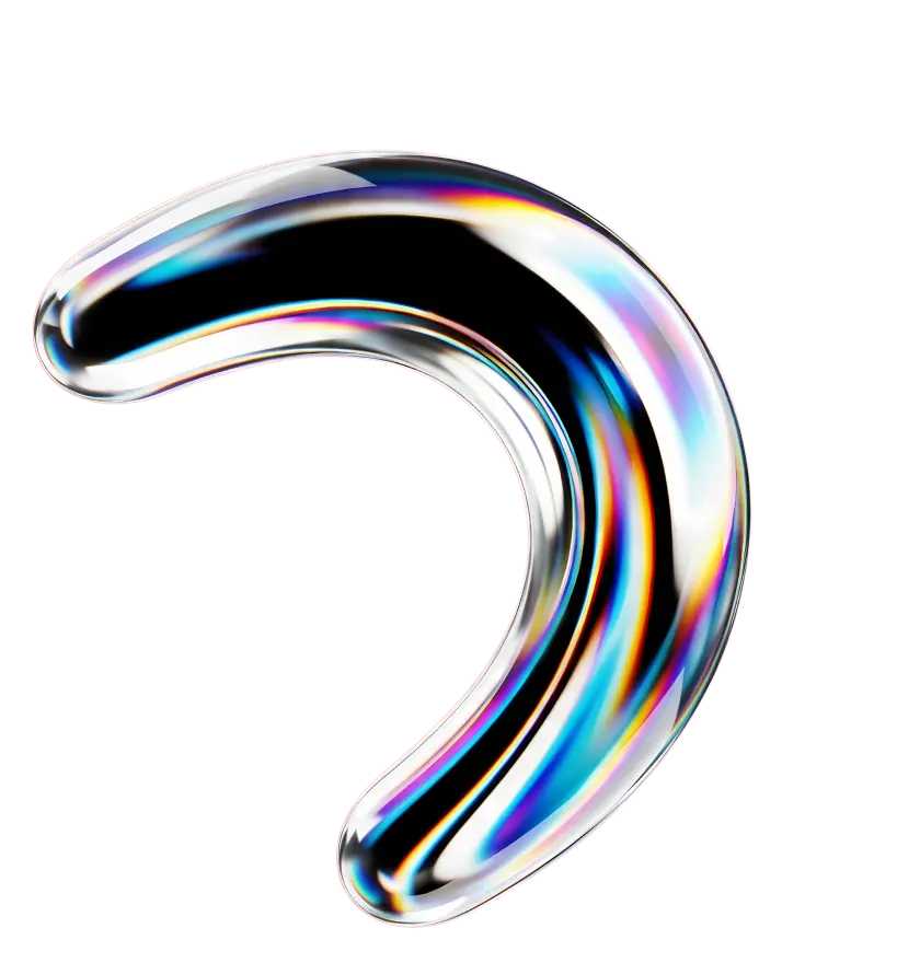 Curved glass or resin object with a prismatic, iridescent surface reflecting multiple colors.