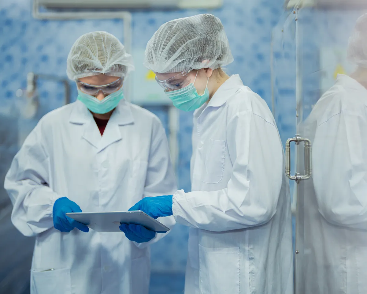 two people performing Industrial hygiene services for medical facilities aero environmental consulting