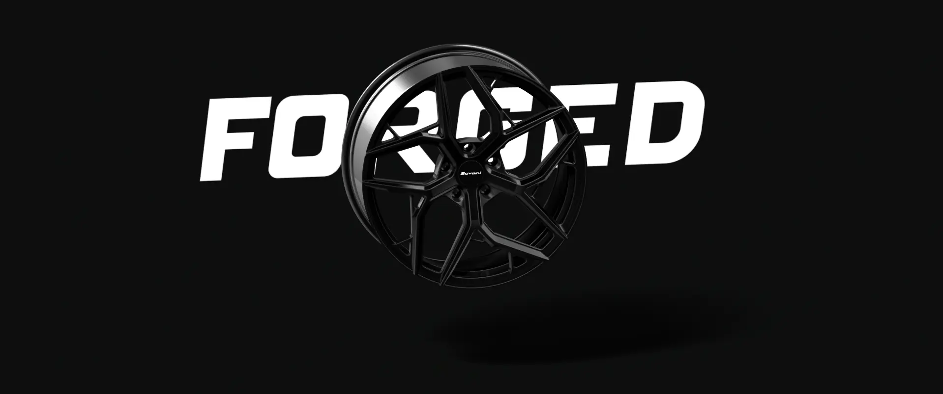 Black forged alloy wheel with intricate spoke design against a dark background with the word FORGED in bold white text behind it.