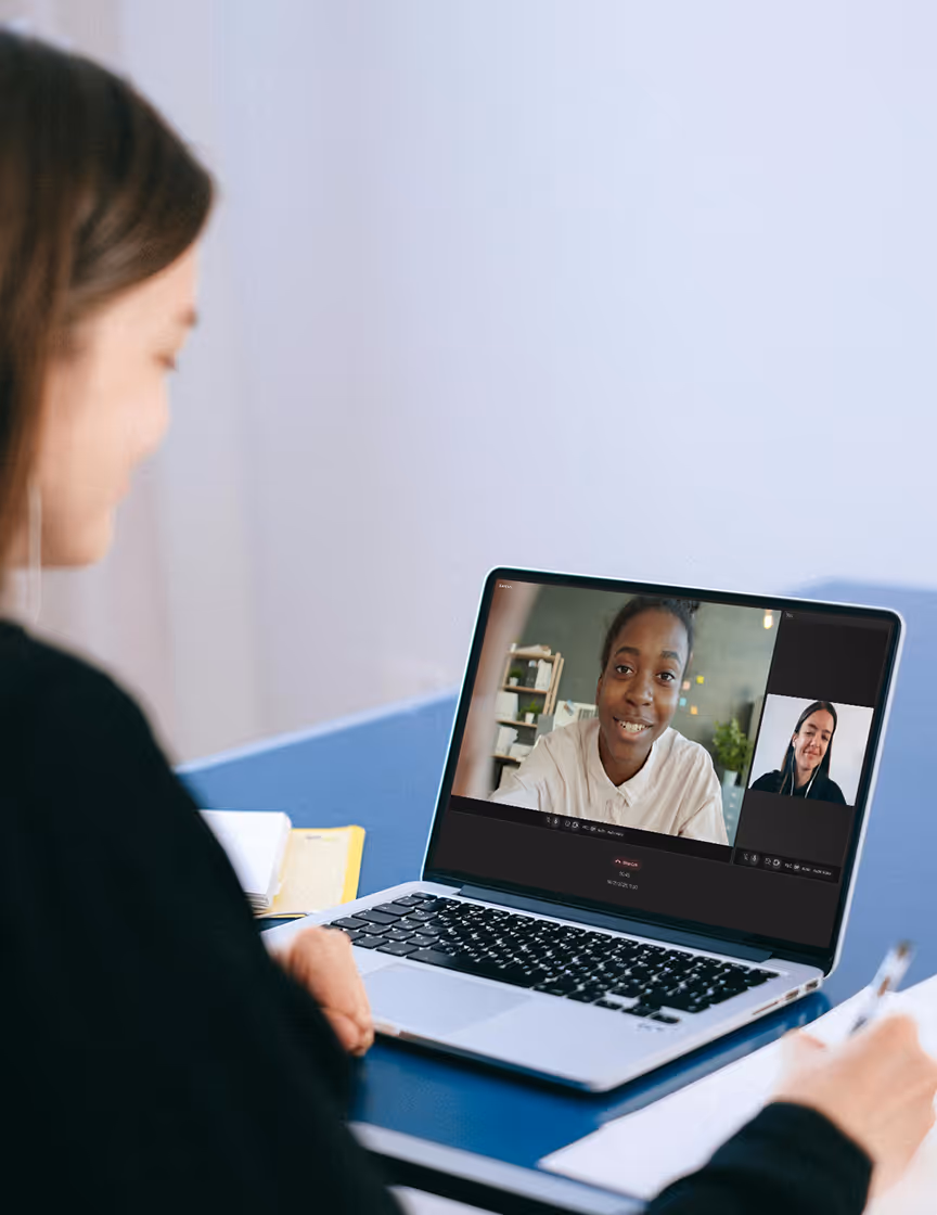 A woman using her laptop to conduct. a remote interview using NowMax