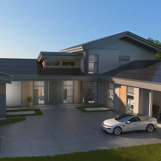 Modernes zweistöckiges Haus mit großem Vorplatz und einem weißen Elektroauto davor, bei Sonnenaufgang.