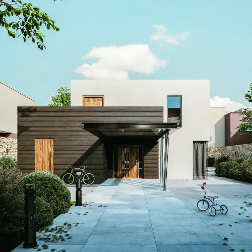 Modernes Haus mit weißem und dunklem Holzdesign, Fahrrad und Dreirad auf dem Gehweg unter blauem Himmel.