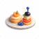 Three small dessert tarts topped with whipped cream and fruit garnishes on a white plate.