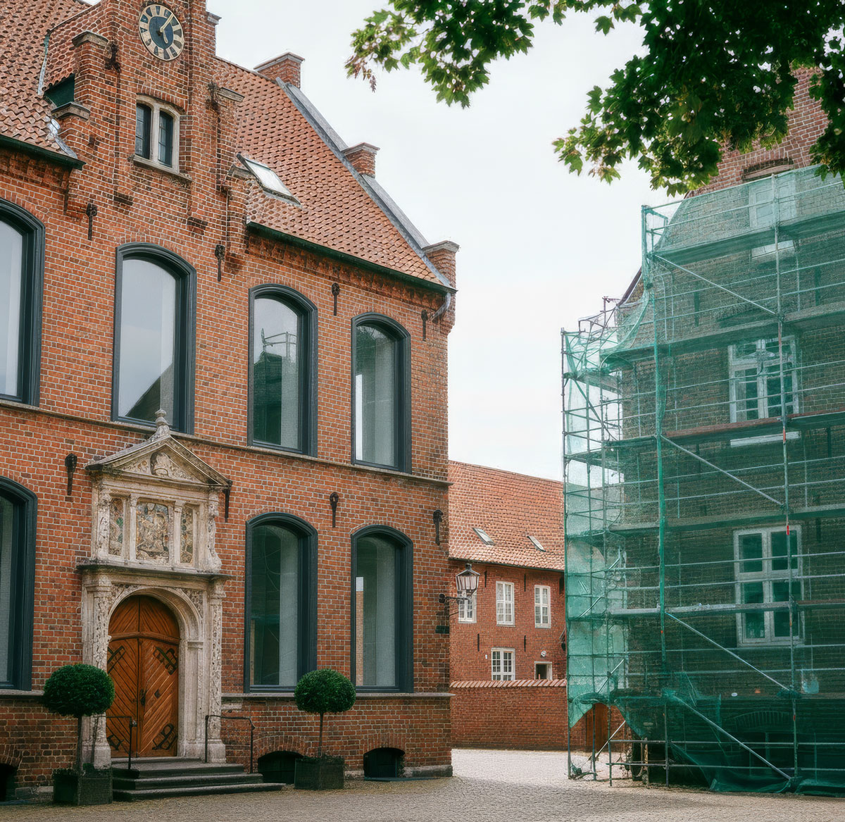 Grayscale image of two engineers working on the installation of solar panels.