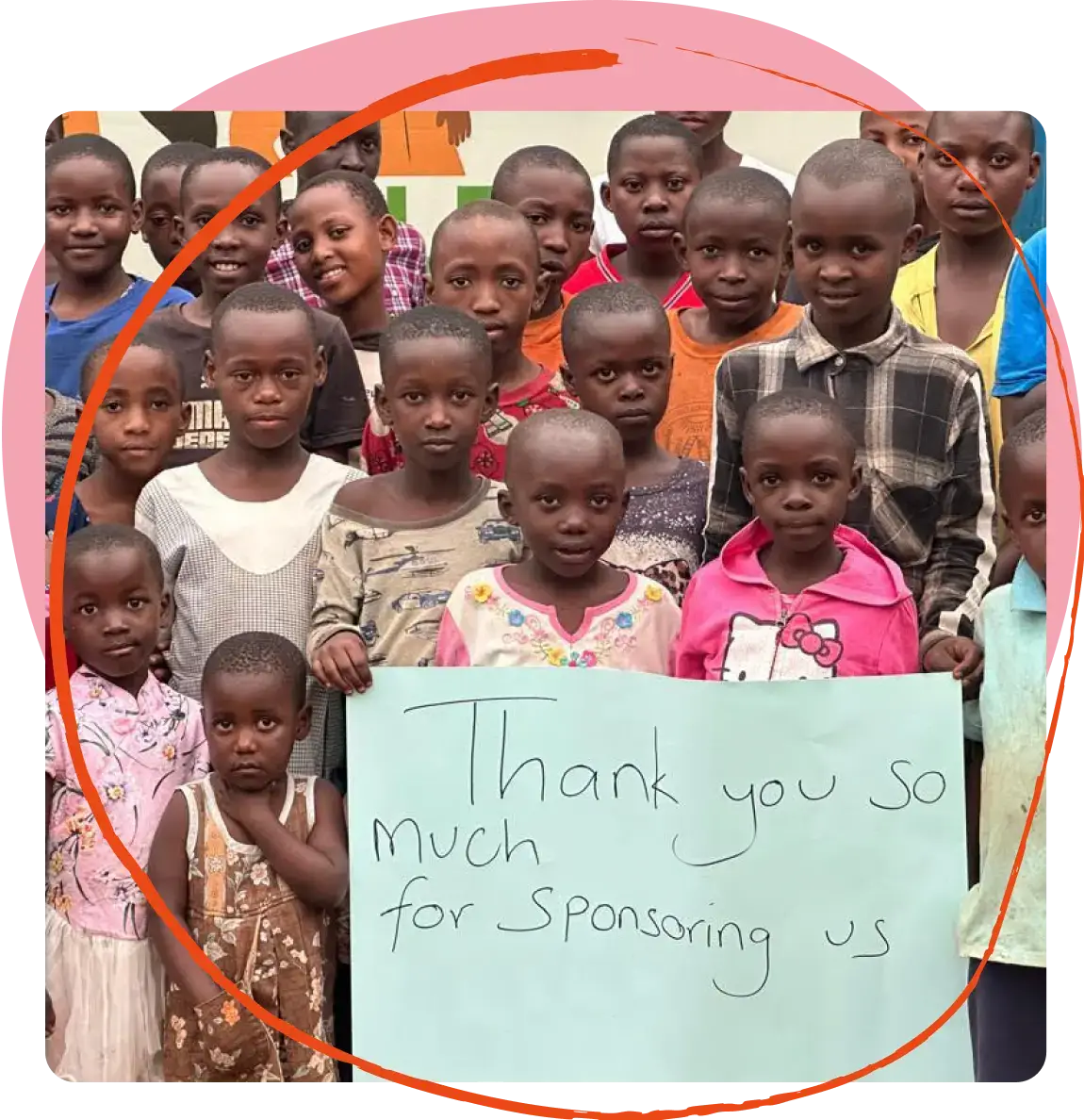 Group of children holding a sign that reads 'Thank you so much for sponsoring us.'
