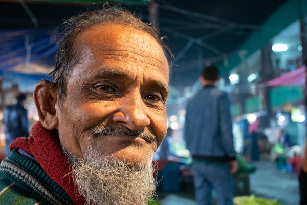 merchant smiling in kawran bazar