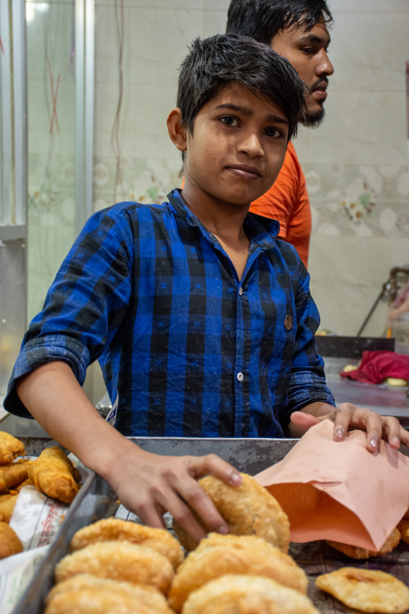 Child selling street food in dhaka, Bangladesh.