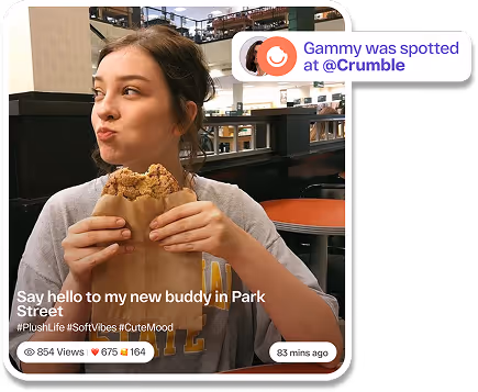 Young woman holding and eating a large cookie in a casual indoor setting with text overlay about meeting a buddy at Park Street and a mention of Gammy at Crumble.