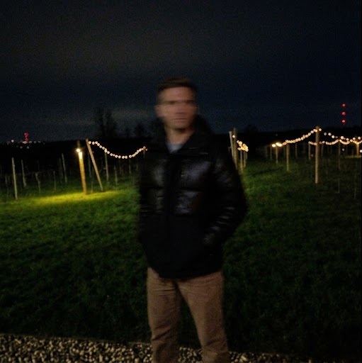 The photo we started with: dark and blurry, taken at night