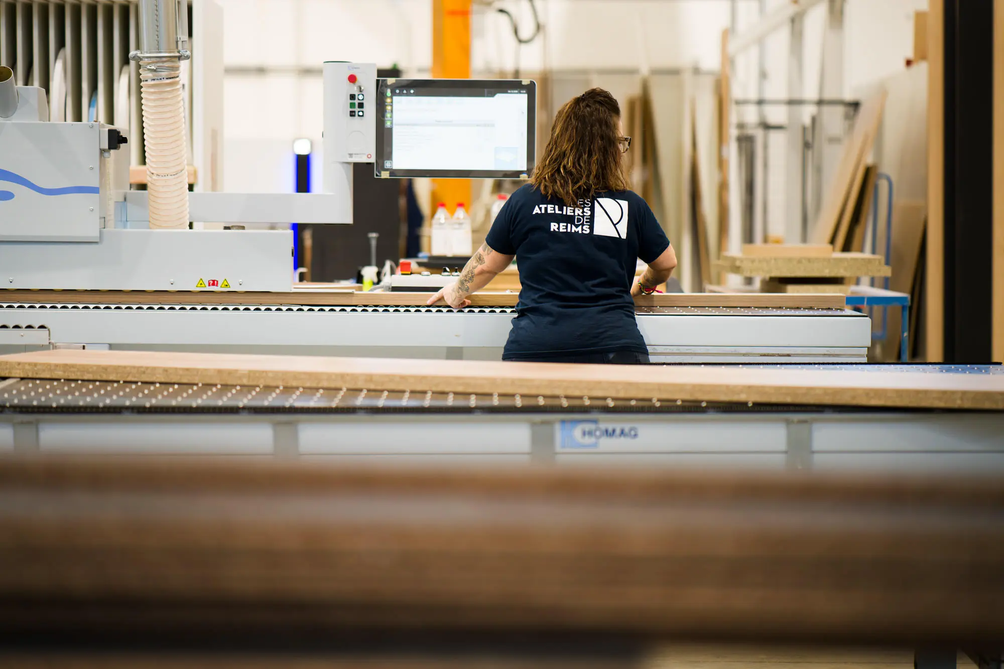 Collaborateurs en atelier — Les Ateliers de Reims