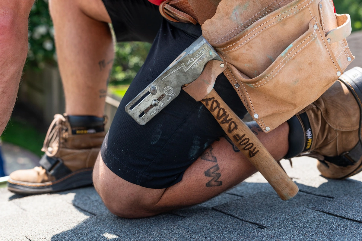 storm-damaged roof with missing shingles needing repair