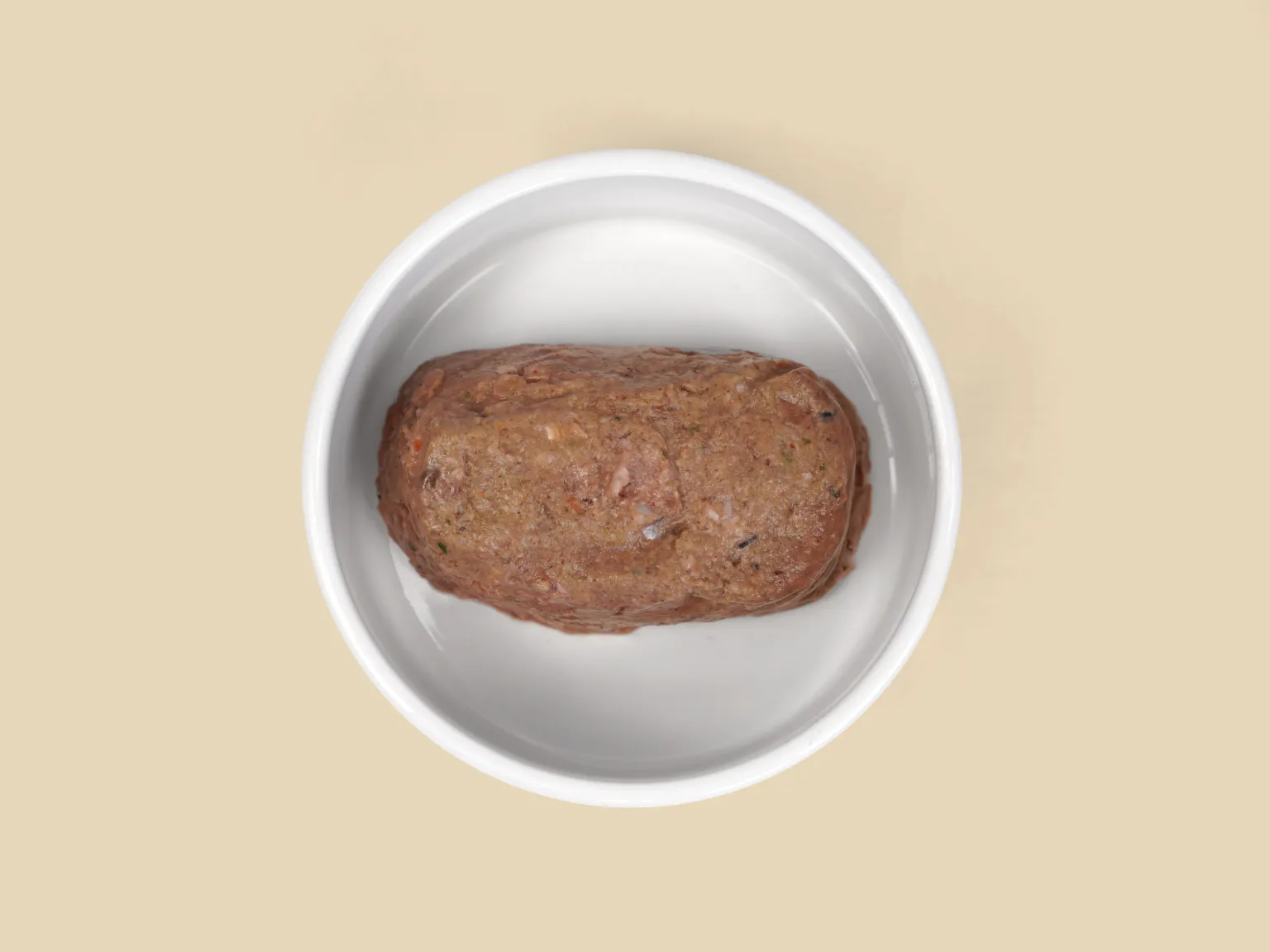 A patty of Sensitive Skin Raw Diet in a bowl.
