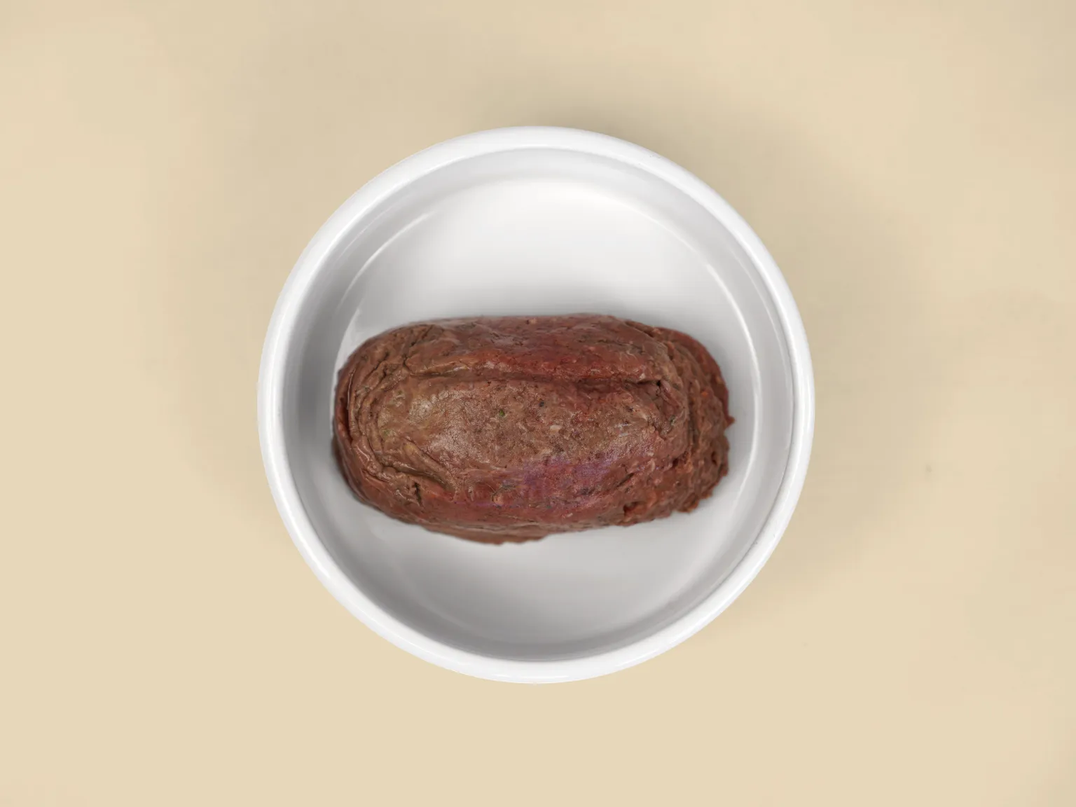 A patty of Kangaroo Low Allergy, Single Protein Raw Diet in a bowl.